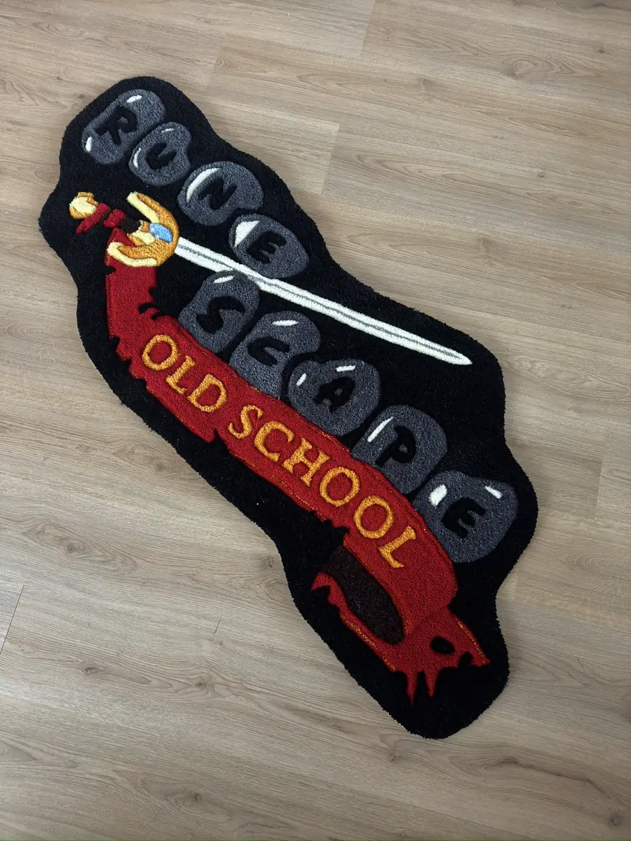 Formklippet teppe i svart og rødt med sverd og banner